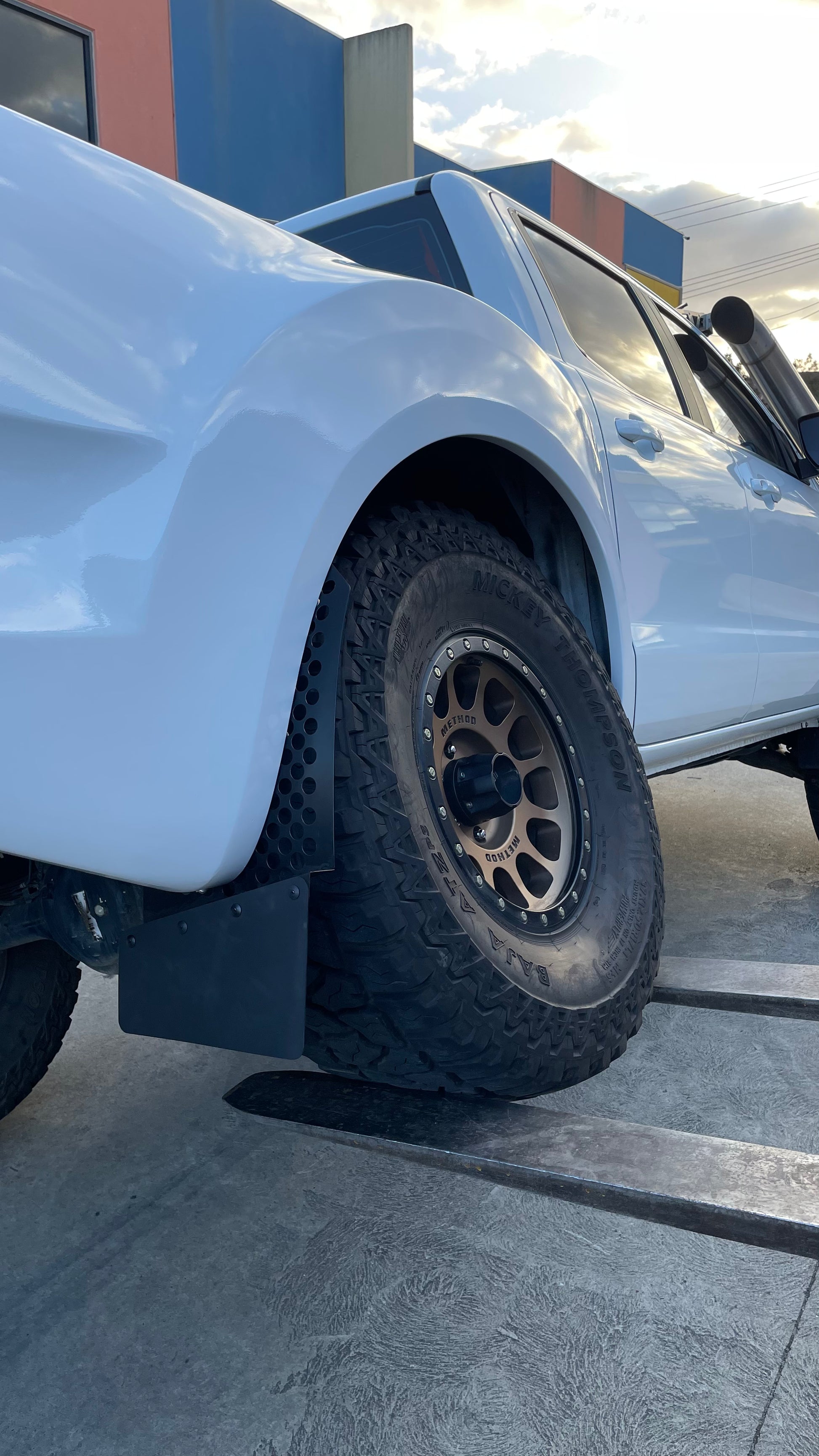 Round Hole Angled offset mudflap – StyleWorx 4x4 Accessories